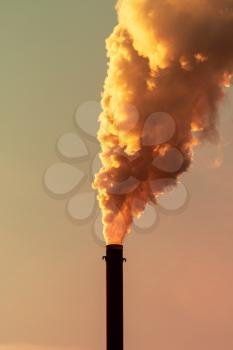 Pollution from smoke stack at a factory production bad for the environment