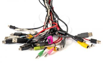 Close-up shot of bundle of various colored cables with various connectors suitable for different ports. 