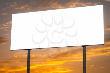 Commercial blank billboard on dusk cloudy sky on background