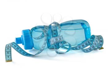 Sport  plastic water bottle wrapped in a blue tailoring meter,  isolated on white background