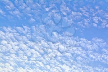 Background of small white clouds on a blue sky
