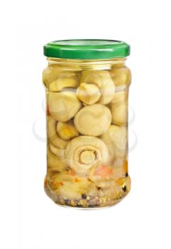 Marinated mushrooms in the glass jar isolated on white


