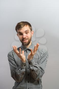 Closeup portrait of handsome young man, scared shocked, astonished by something, hands on chest, in disbelief, isolated on white background. Human face expression, emotion, feeling, reaction, attitude