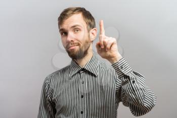 Guy pointing up with his index finger