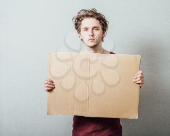 man holding cardboard