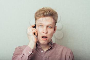 casual young man talking on the phone