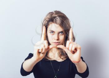 girl doing hand frame