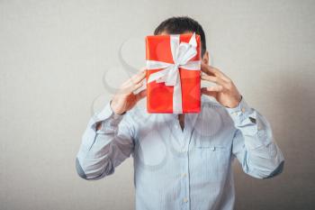Businessman hold with gift box
