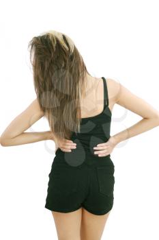 Closeup of young woman suffering from back pain 
