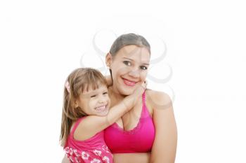 Portrait of Hispanic pregnant woman with daughter isolated over white background