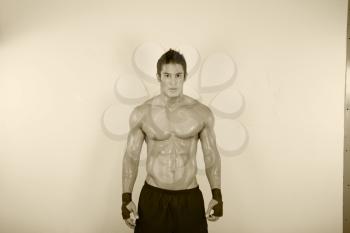 vintage image of muscle man posing in gym