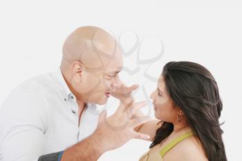 Studio shot of a young couple fighting 