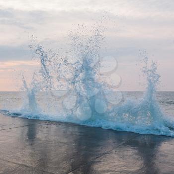 Splashing wave during high tide in Saint Malo, Brittany, France