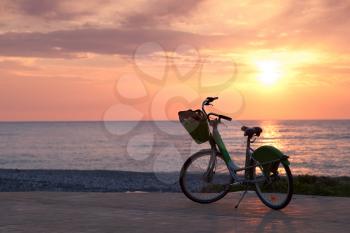 Bicycle on the pavement on Batumi beach, sunset