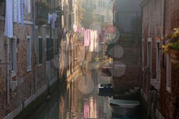Drying clothes on the rope across venetian channel