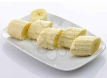 Freshly sliced bananas on a plate 