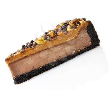 a slice of cheesecake with chocolate chips and nuts