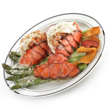 Grilled Lobster Tail Served With Asparagus On White Background