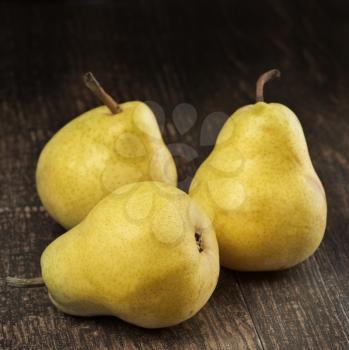 Yellow Pears On Wooden Background