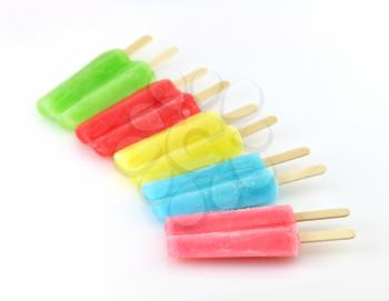 colorful ice cream pops on a white background