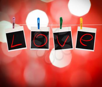 Instant photos with love word hanging on a clothesline, red defocus background