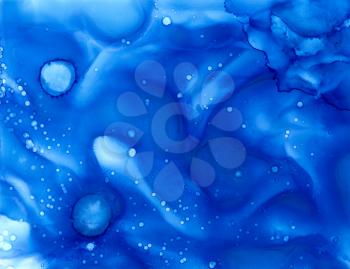 Abstract backdrop blue dots.Colorful painted background hand drawn with bright inks and watercolor paints. Bright color splashes and splatters create uneven artistic background.