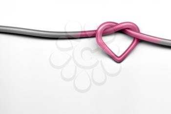 pink heart knot on white background - valentine day concept
