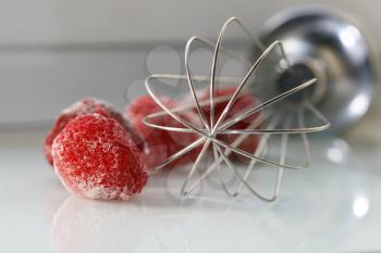 Royalty Free Photo of a Whisk and Strawberry