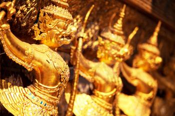 Royalty Free Photo of Golden Garuda Sculptures at Royal Palace in Bangkok, Thailand