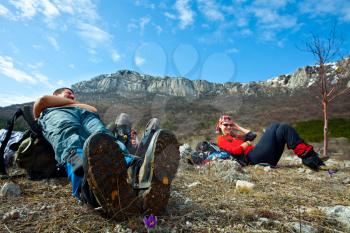 Royalty Free Photo of Two People Resting on a Hike