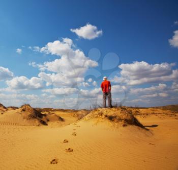 Royalty Free Photo of a Hiker in the Desert