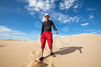 Royalty Free Photo of a Man Hiking in Great Sand Dunes National Park, USA