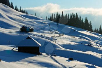 Royalty Free Photo of a Building on the Side of a Mountain in Winter