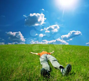 Royalty Free Photo of a Man Relaxing in a Field