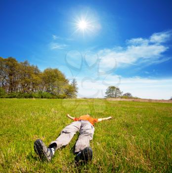 Royalty Free Photo of a Man Resting in a Field