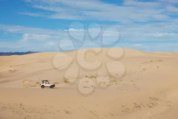 Royalty Free Photo of a Vehicle in the Desert