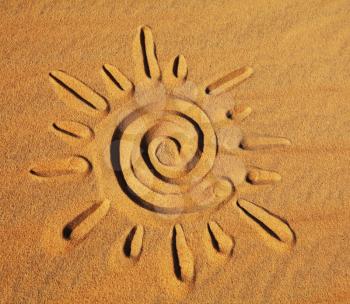 Royalty Free Photo of a Sun Drawn in the Sand