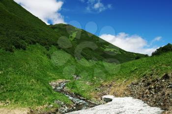Royalty Free Photo of a Small Mountain and River