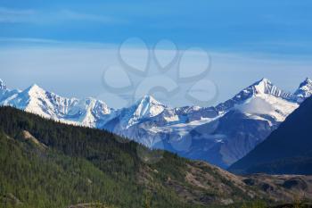 Picturesque Mountains of Alaska in summer. Snow covered massifs, glaciers and rocky peaks.