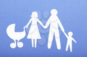 Closeup of paper family on green background