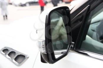 Automobile rear-view mirror of white color with the turn repeater