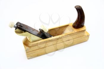 Wooden plane, boards and a shaving on a white background