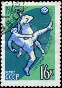 USSR - CIRCA 1963: stamp printed in the USSR (Russia) shows football with the inscription and name of a series 1963, Third Games of people of the USSR, circa 1963