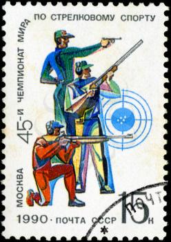 USSR - CIRCA 1990: A stamp printed in USSR shows men with a weapon, with inscription and name of series 45th World Shooting Championship Moscow, circa 1990