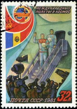 USSR - CIRCA 1981: A stamp printed in the USSR, shows international flights in space, circa 1981