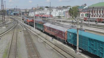 BARNAUL - AUGUST 22: Cargo red train rides on the railway station on August 22, 2017 in Barnaul, Russia.
