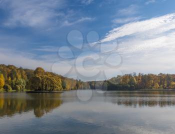 Autumn foliage with water reflection natural landscape.