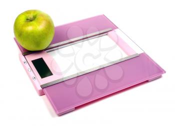 floor scales and green apple isolated on white background