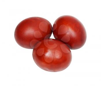 three red Easter eggs on a white background
