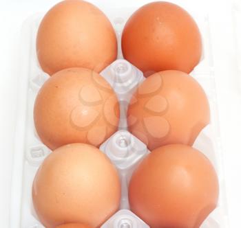 Fresh brown country eggs packaged in a dozen carton 